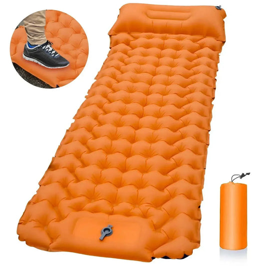 Ultralight outdoor inflatable sleeping pad with built-in pillow and compact storage in bright orange
